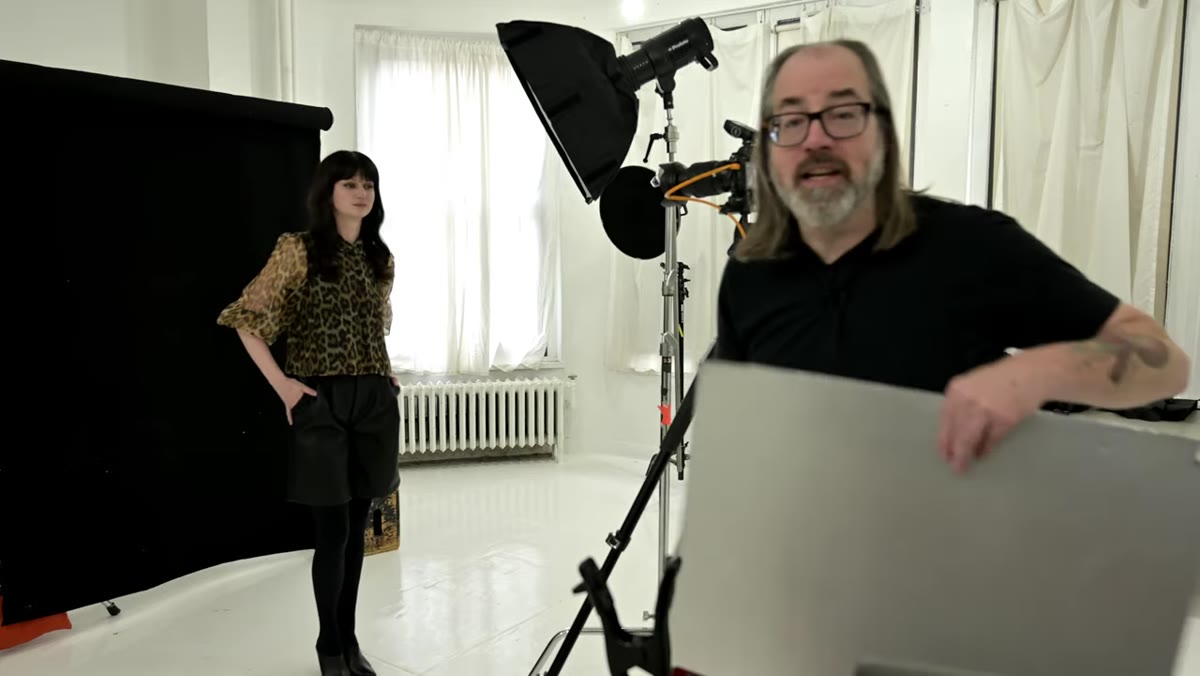 White reflector card brought in to fill shadow side of face