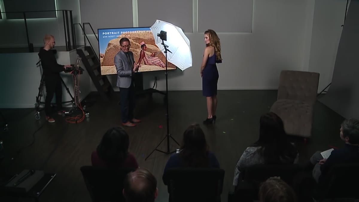 Instructor demonstrating the pose himself, facing the model as a mirror