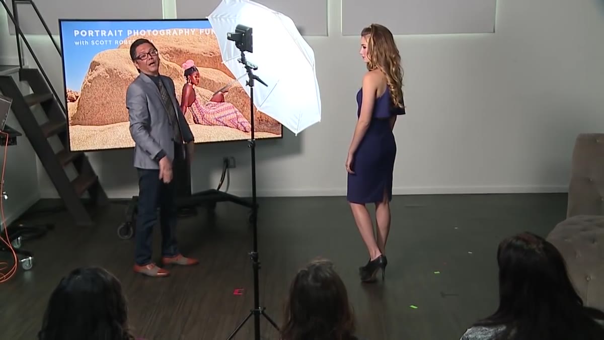 Model&rsquo;s hands positioned at the same level, instructor about to correct