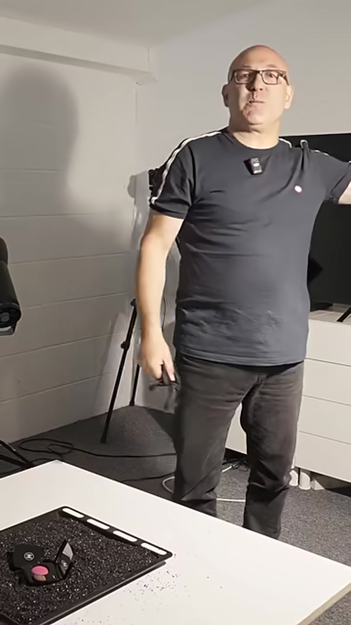 Photographer positioning over a product on a table
