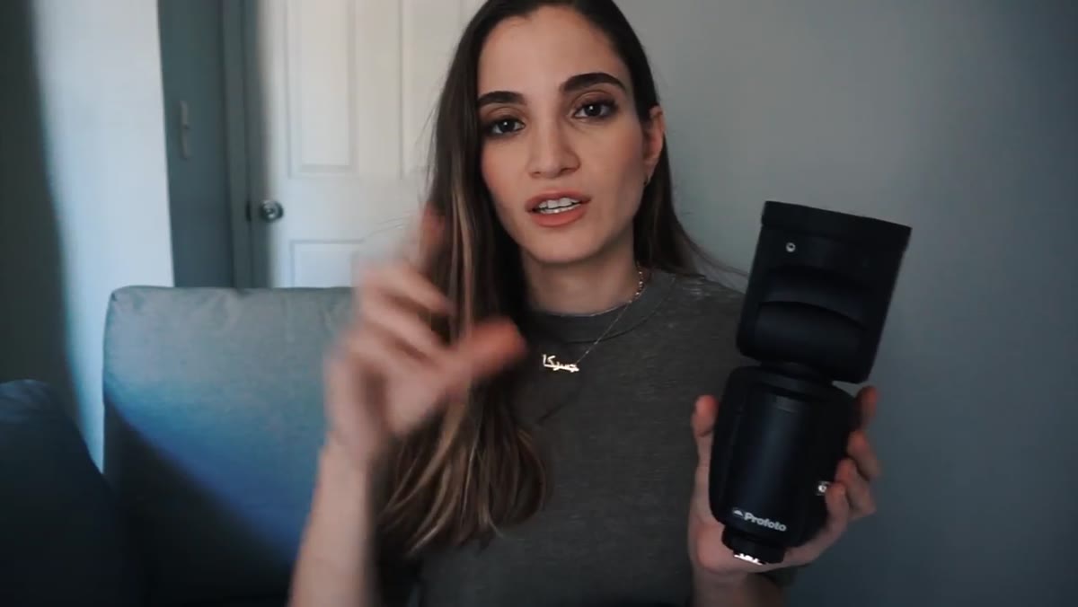 Rechargeable battery removed from the base of the flash