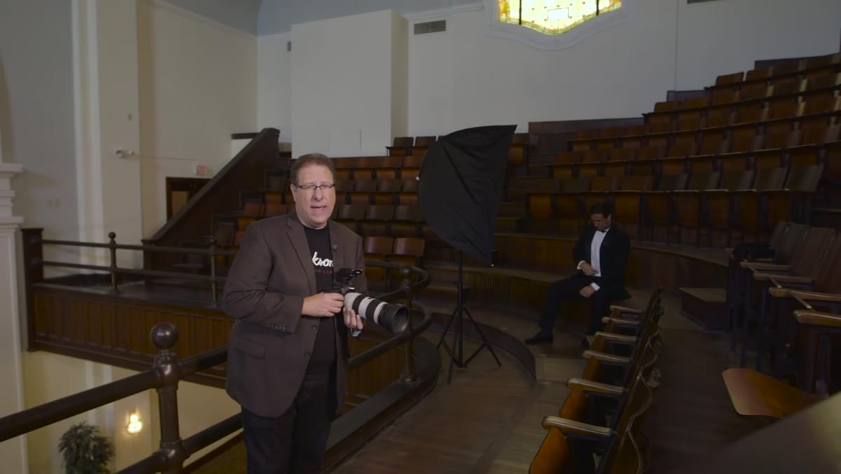 Photographer shooting without flash, dark exposure visible