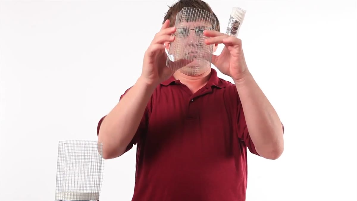 Rolling wire screen into a tube around the PVC adapter nose