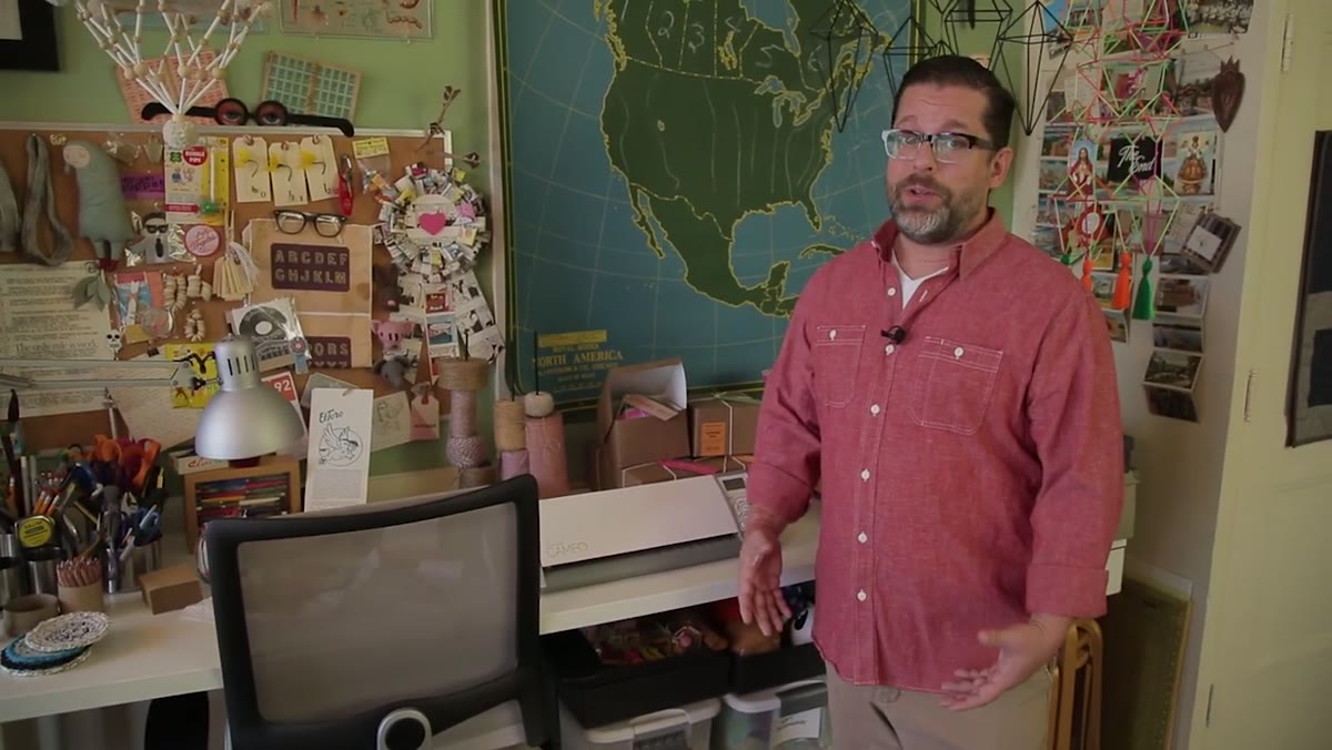Vintage schoolhouse maps, teaching charts, and pull-down reference materials on walls