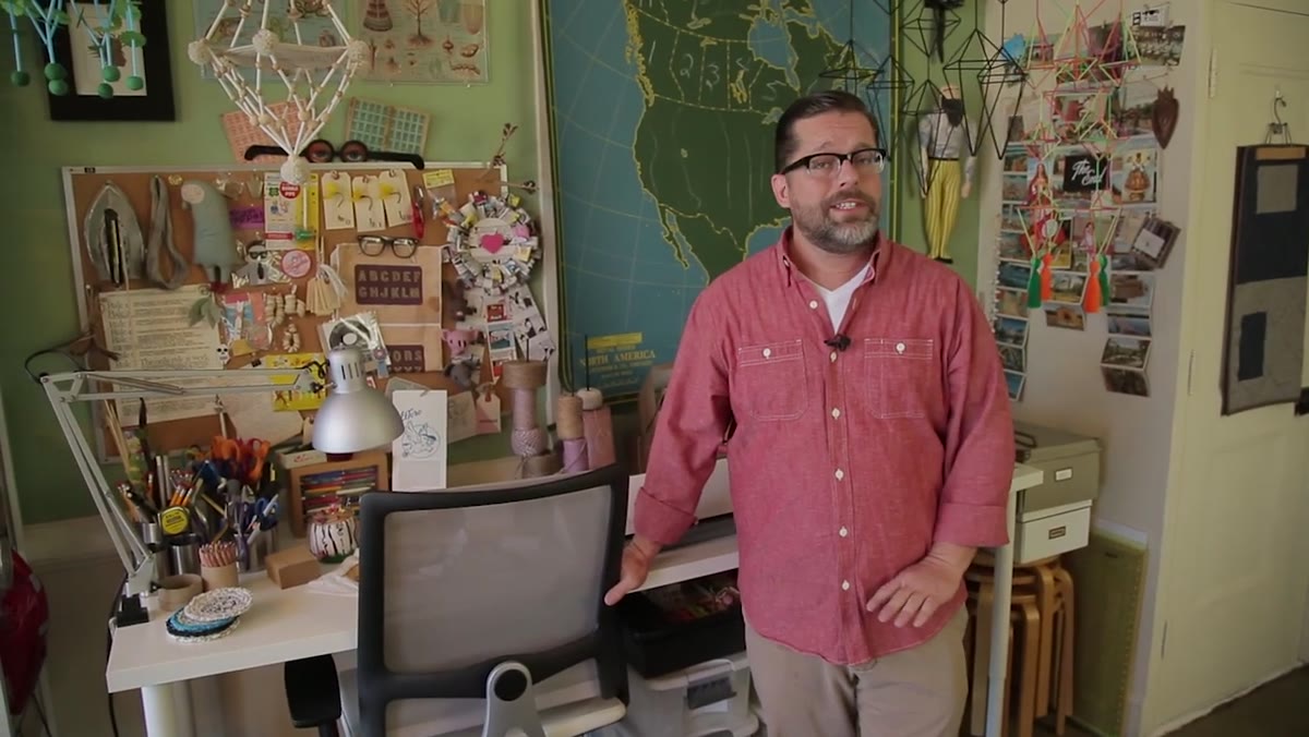 Overview of the compact shared studio with organized work surfaces