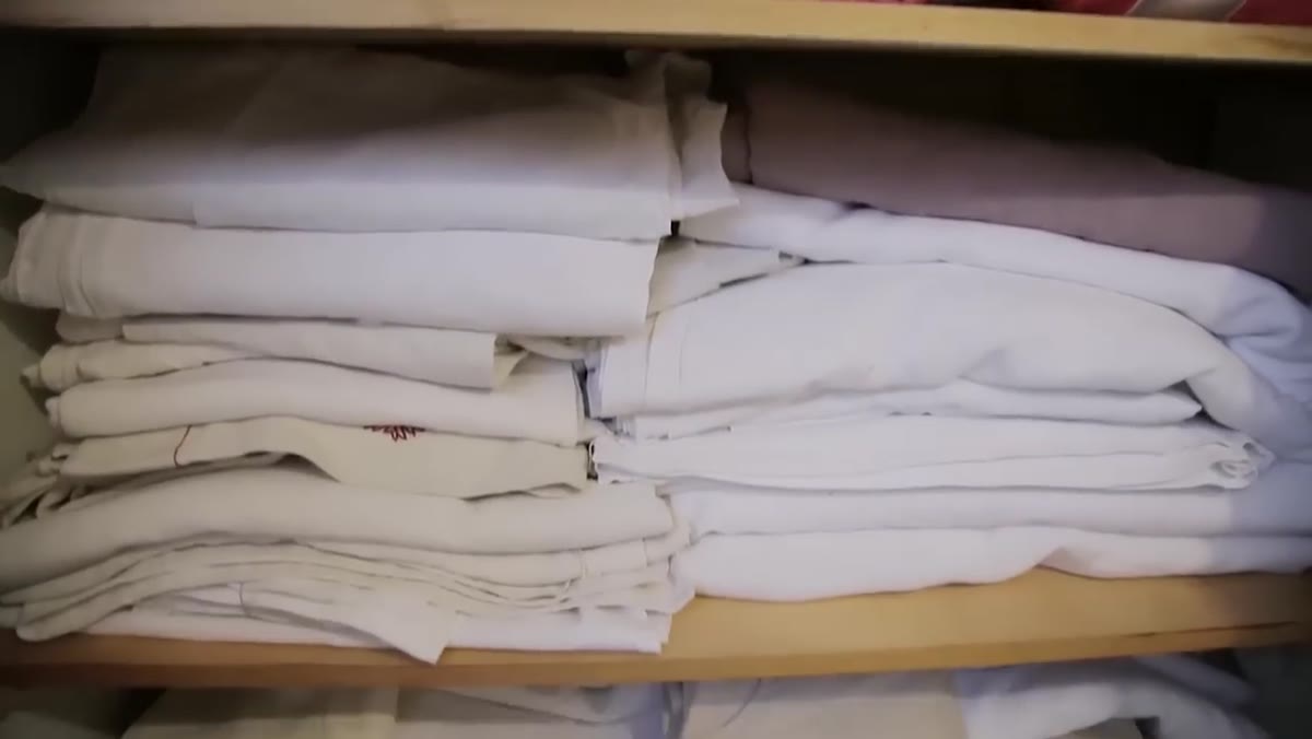 Meng organizing the linen closet by fiber type and weight