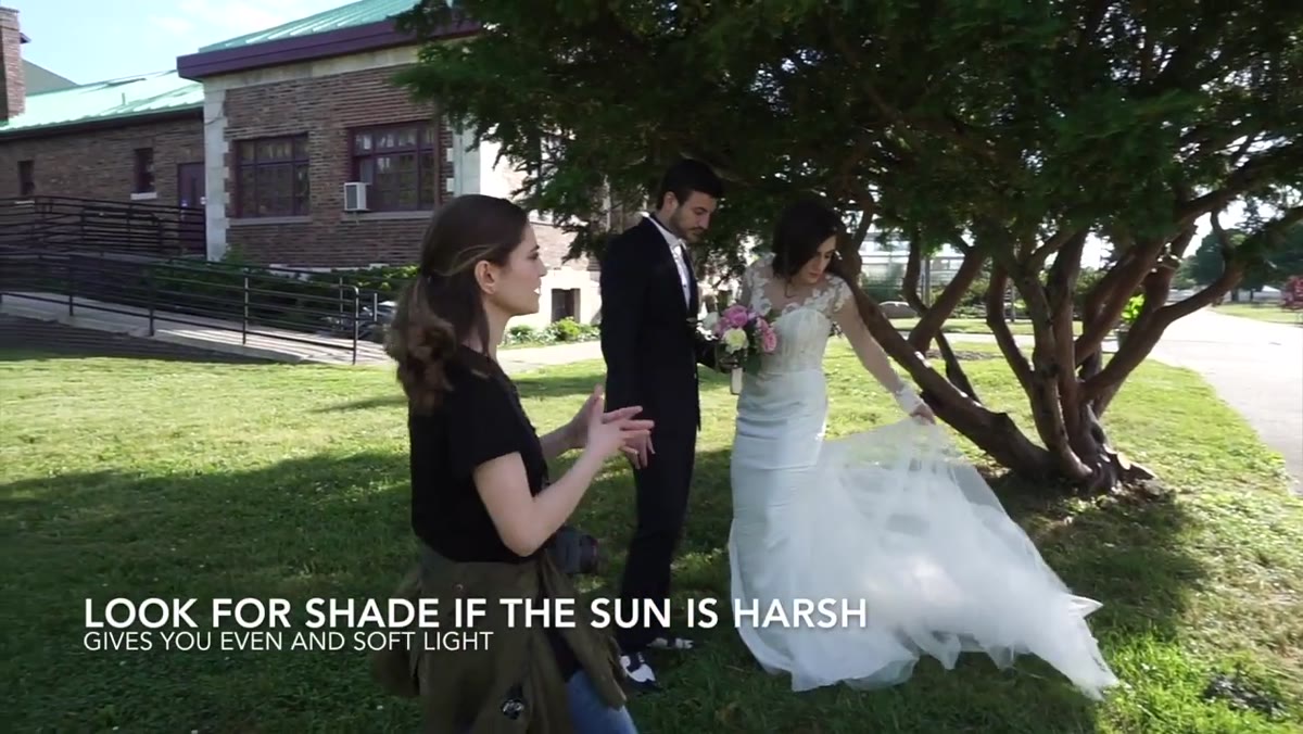 Couple standing in open shade, dress detail visible
