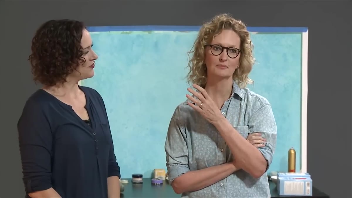 Anne Geddes speaking to camera in studio setting