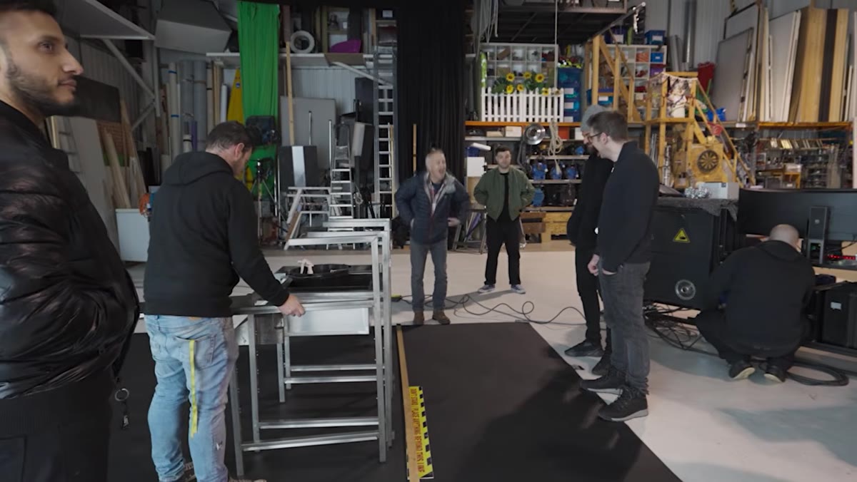 Instructor and crew visibly cold in unheated studio