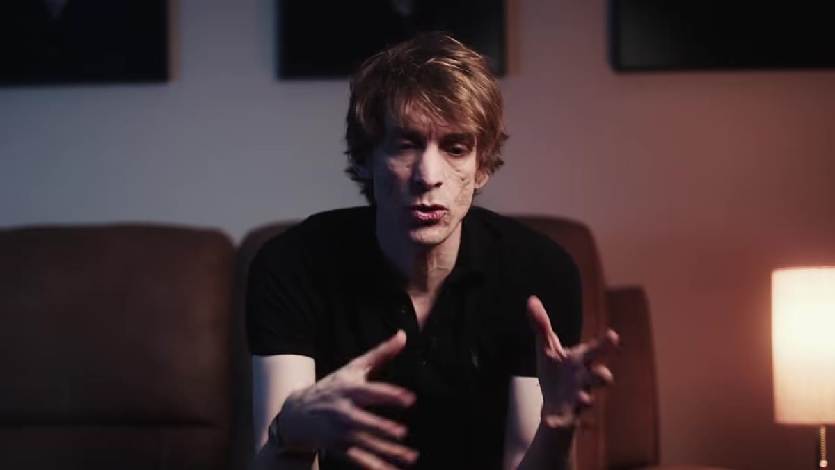 Tucker gesturing as he describes the photographer&rsquo;s role in a place