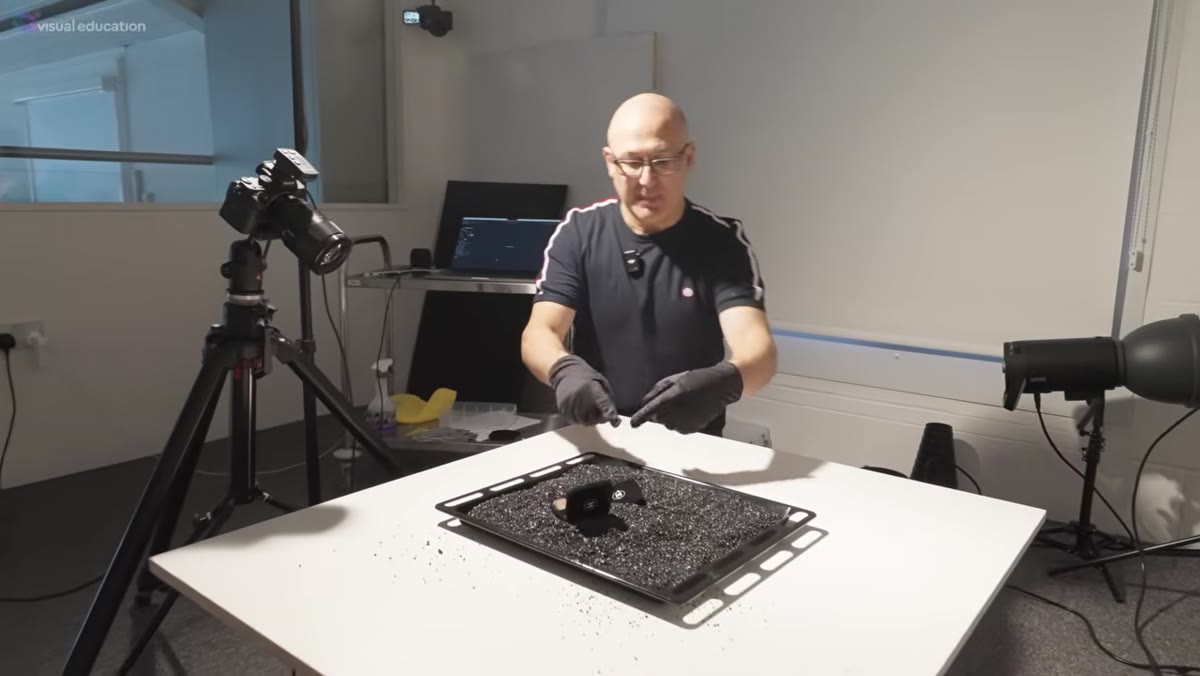 Black gravel poured into a kitchen baking tray